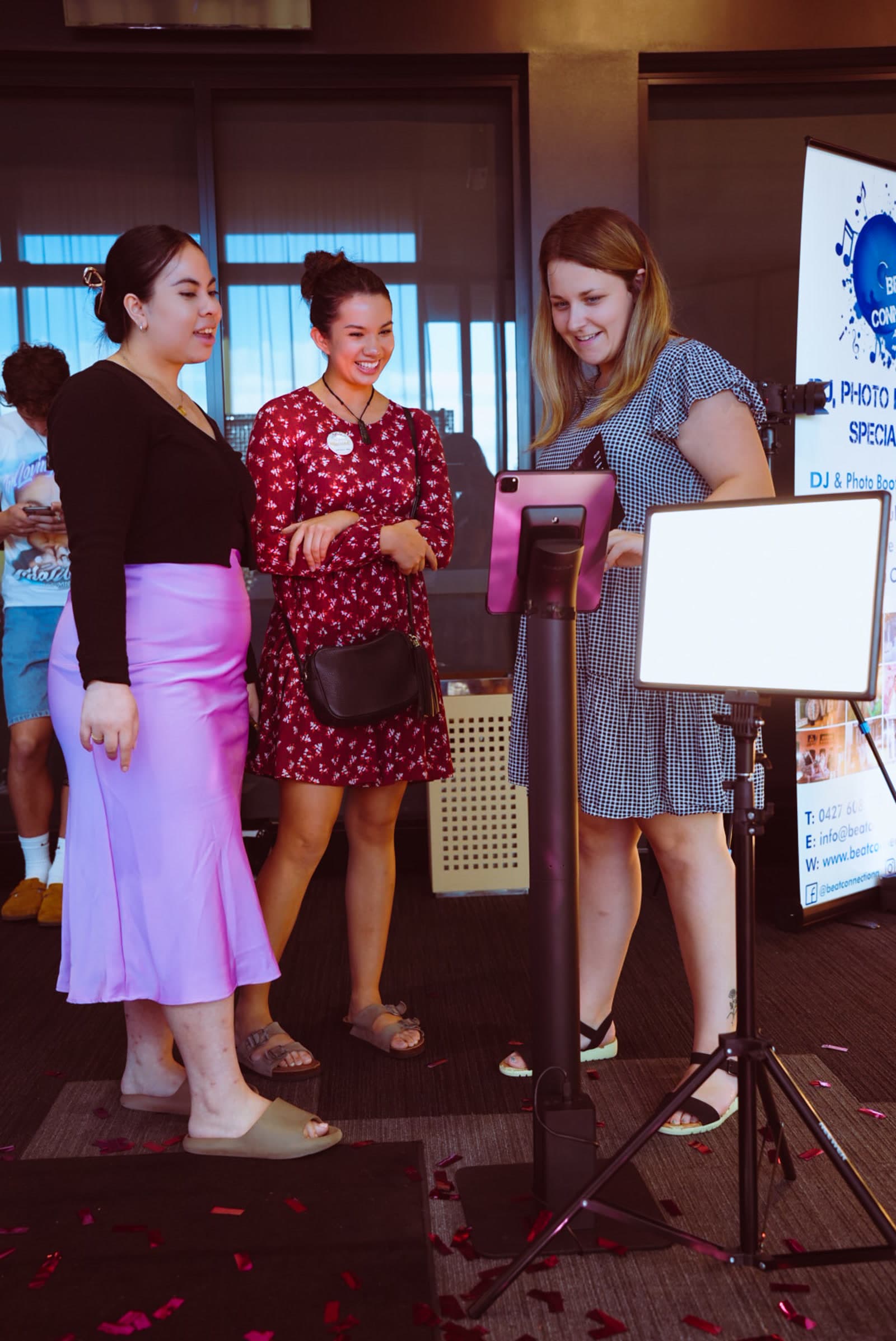 Guests using a branded Stage360 sharing kiosk at a corporate event activation